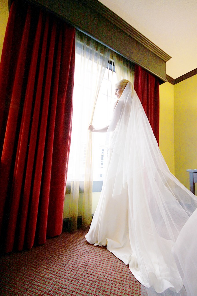 Standing at window Wedding Day