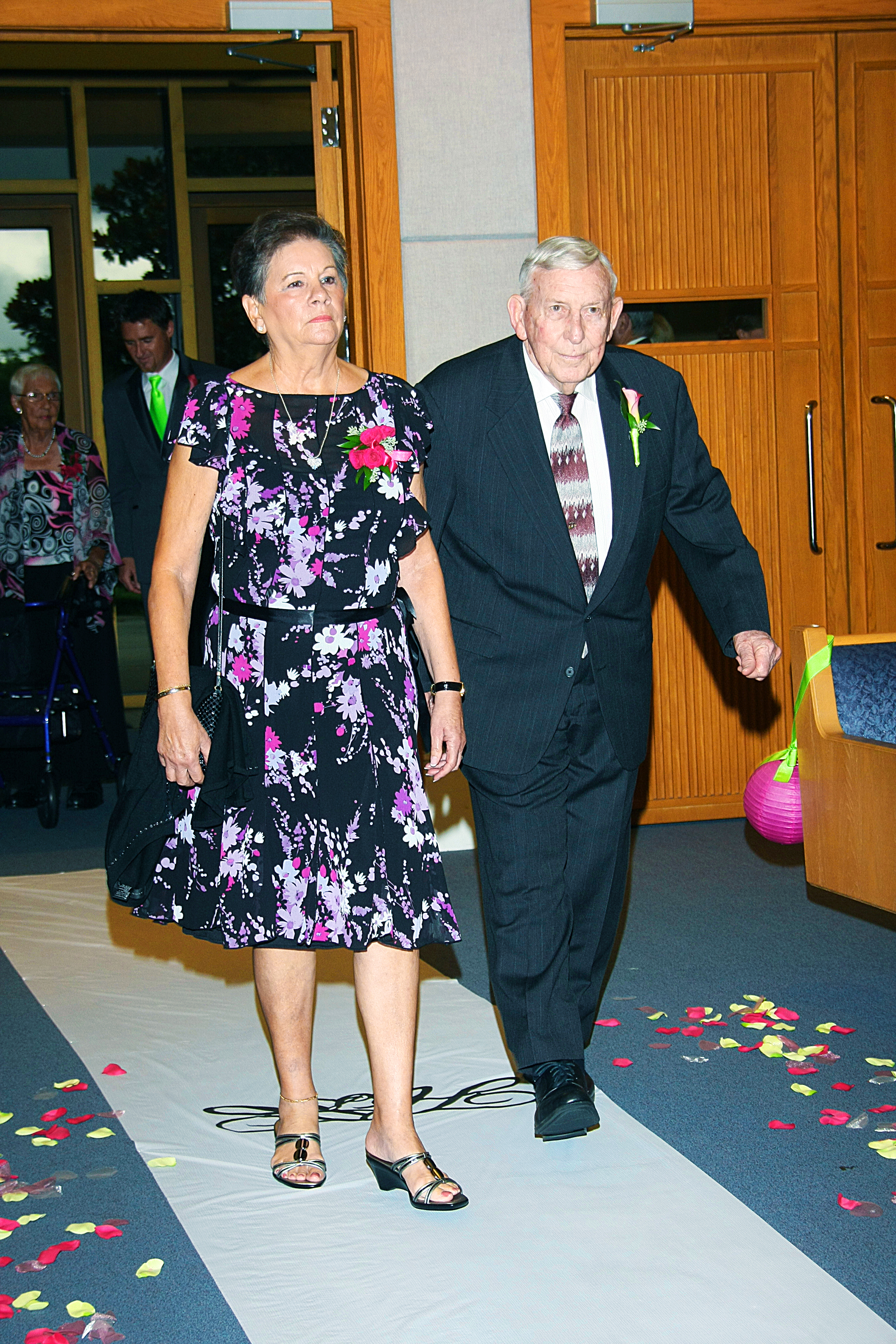 Grandparents walking down aisle