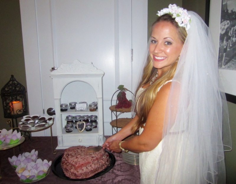 bridal shower bride cuts cake