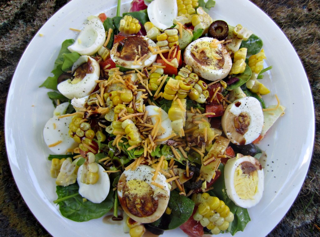 healthy salad with eggs vegetables and corn