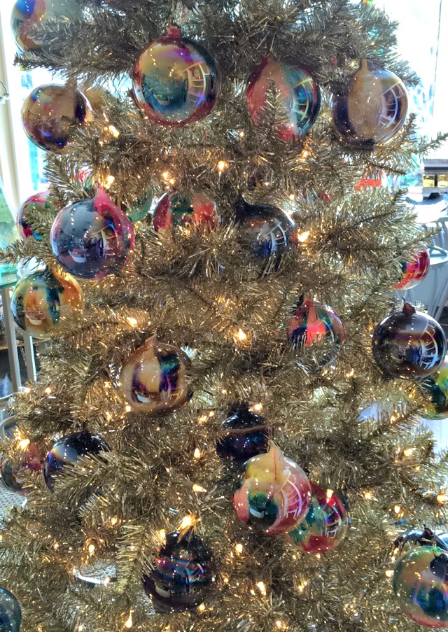 gold christmas tree with glass ornaments
