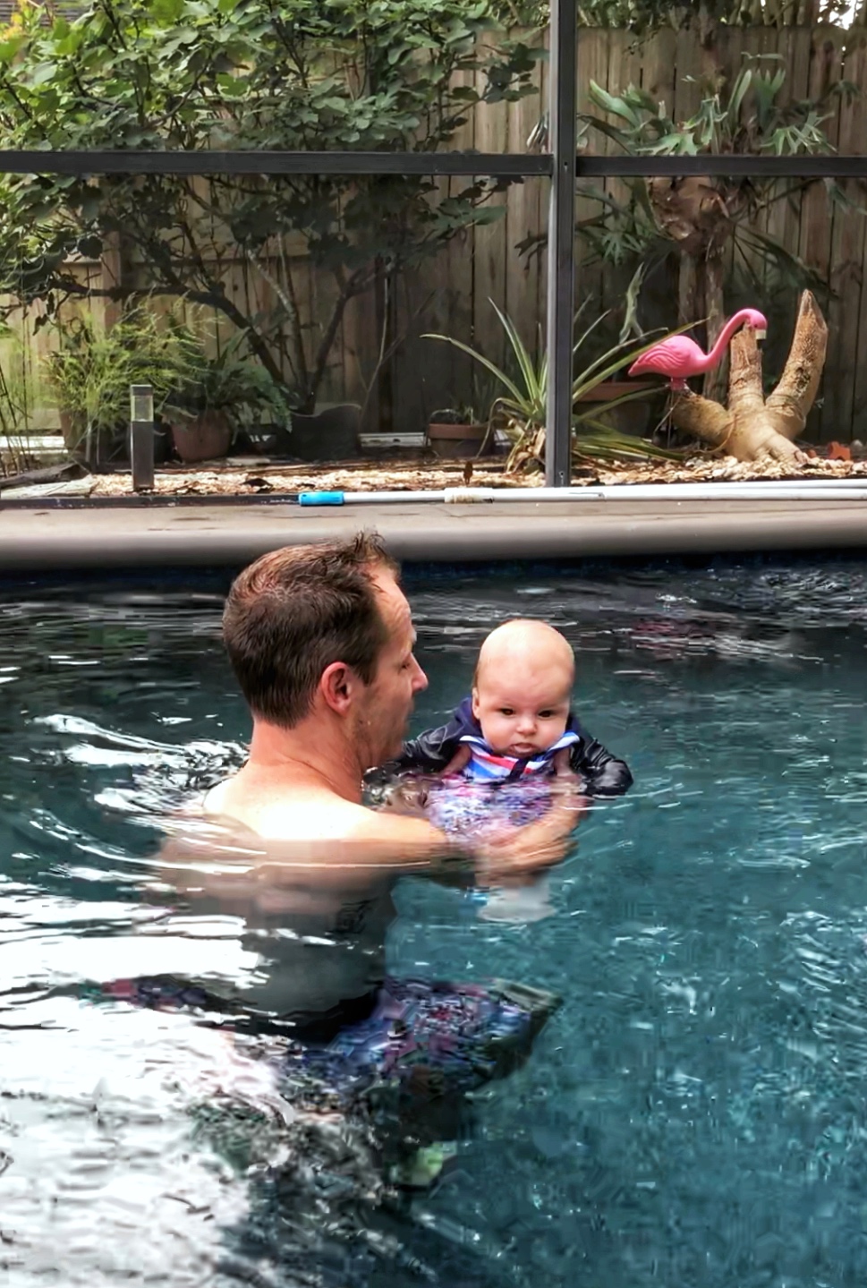 Scott and Skyler in pool swimming